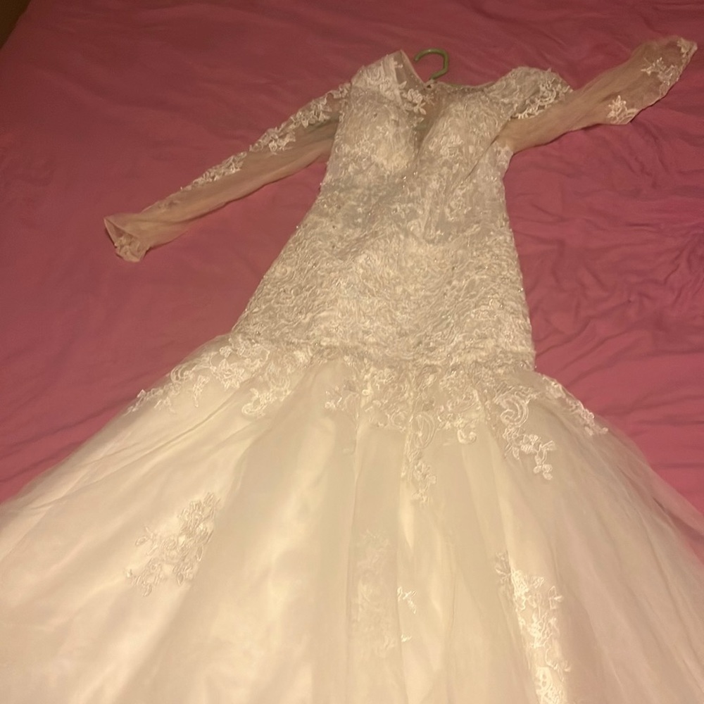 This is a size 2 wedding dress that I brought but never wear, it is a mermaid .